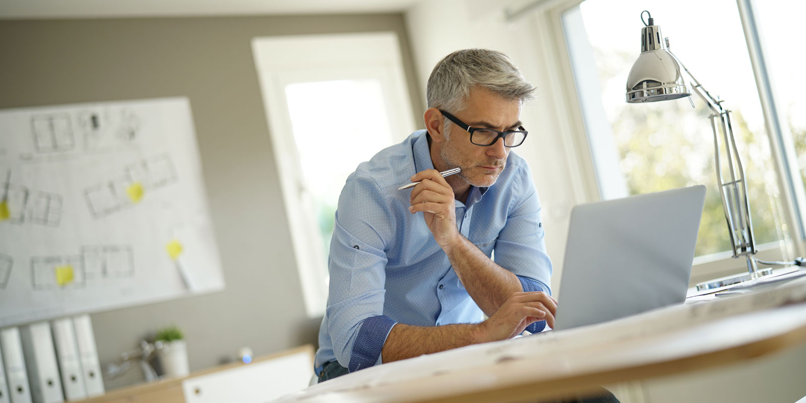 man browsing on his laptop