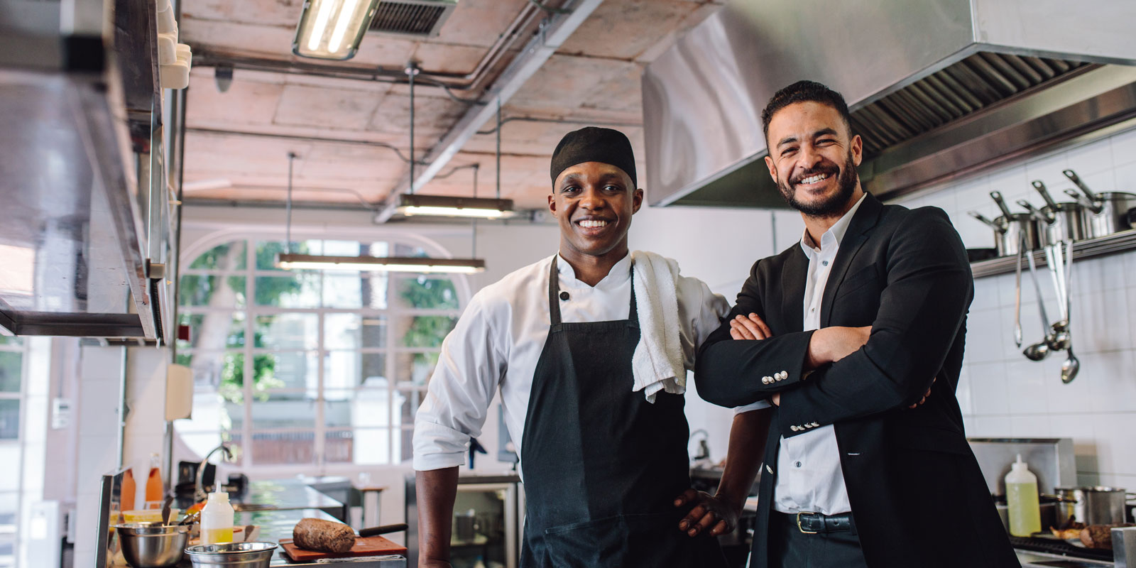 business man taking a photo with a chef